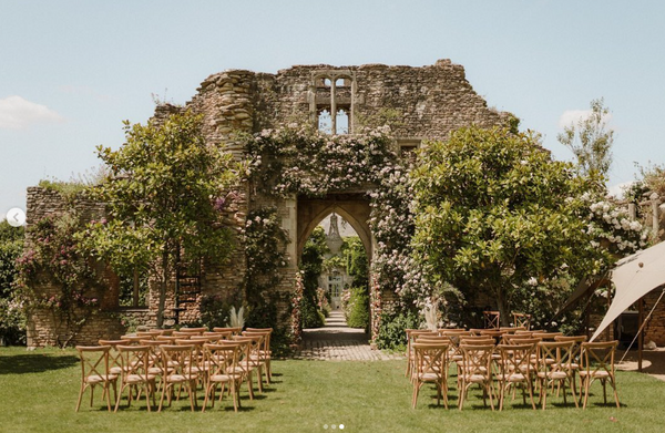 Outdoor garden wedding ceremony. Romantic lawn wedding ceremony