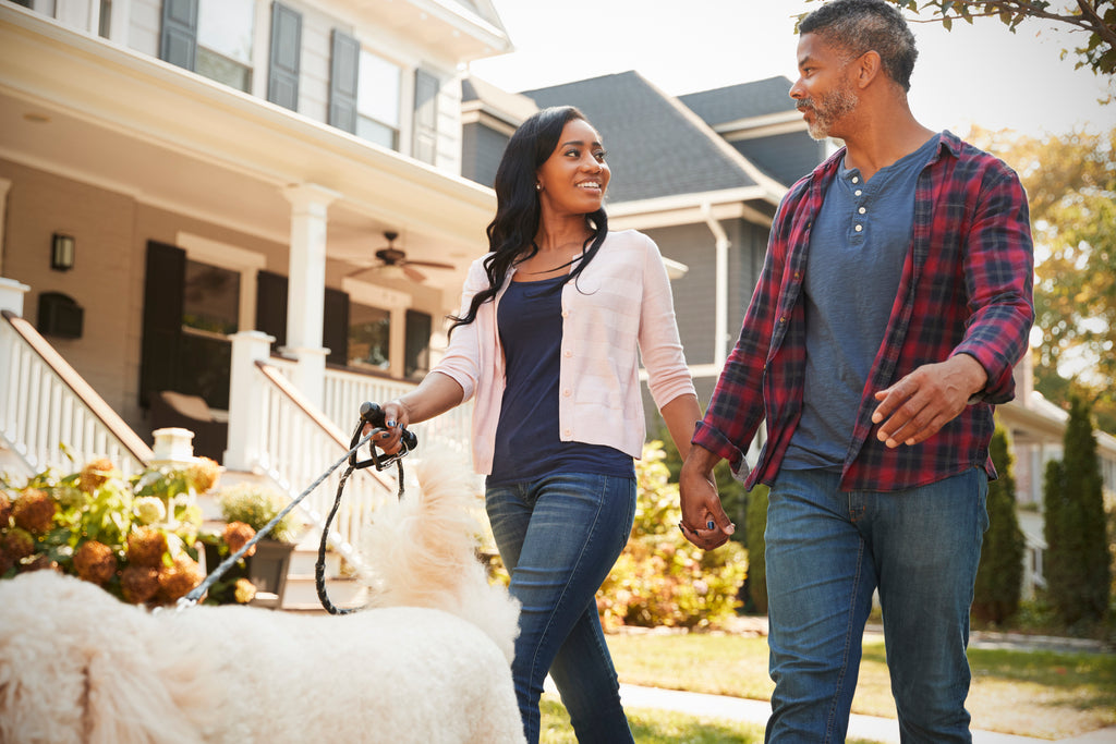 Couple walking outside neighborhood for sunlight and exercise if you can't sleep