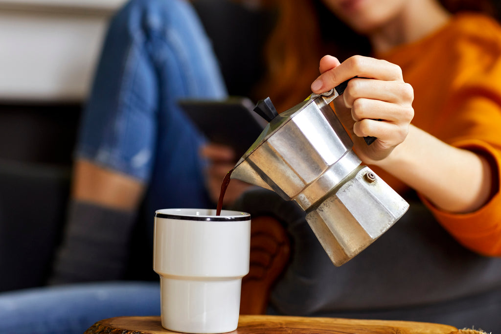 pouring coffee from moka pot