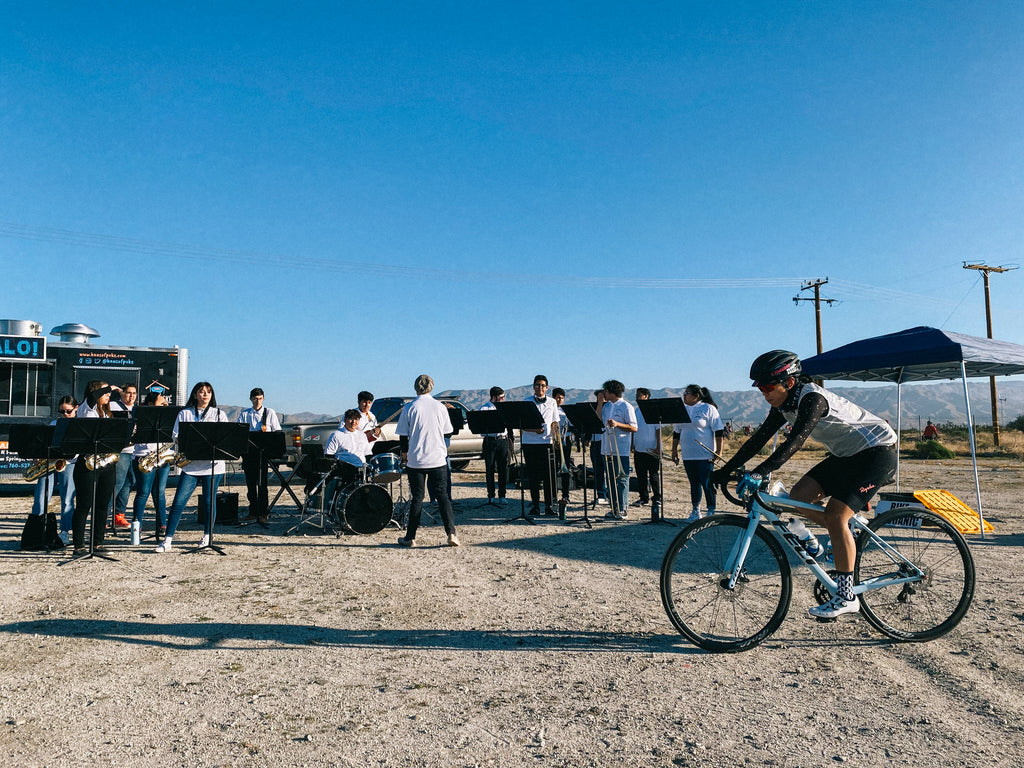 A band plays as riders arrive at stop #1