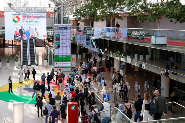 Crowd during the rehacare exhibition on escalators