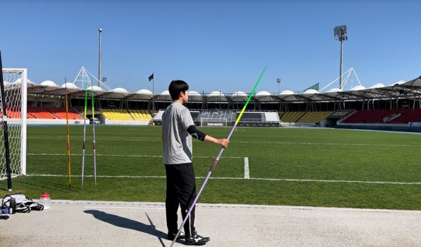 Park Ah Young standing with a javelin