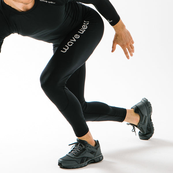 action shot of a man in a low run in the wavewear mens leggings