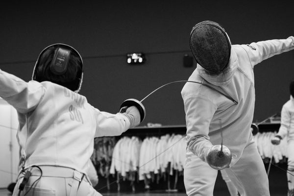 2 fencers in a match with one of them getting stuck