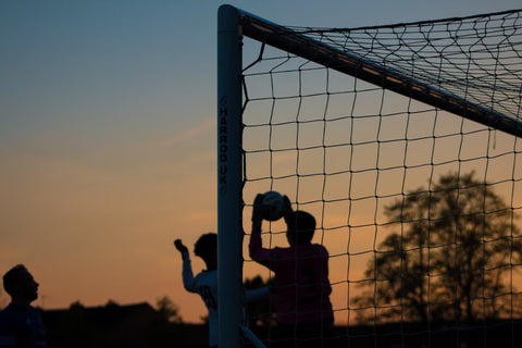 Soccer net and soccer players 