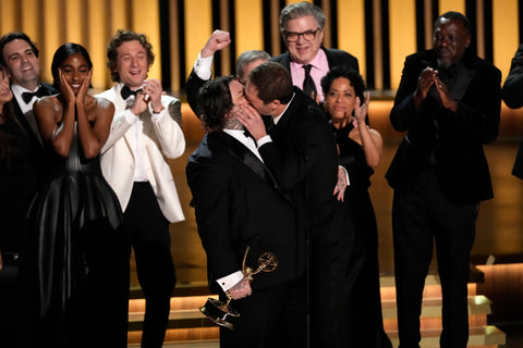 Matty Matheson and Ebon Moss-Bachrach share a celebratory, surprise kiss while accepting the 2024 Emmy for Outstanding Comedy Series for The Bear.