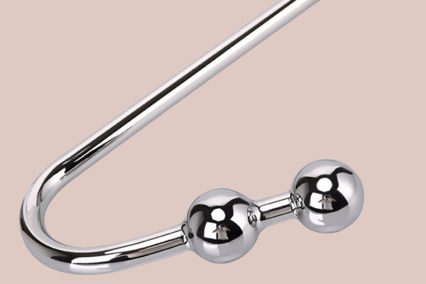 Sleek BDSM anal hook designed for pleasure, featuring a shiny, polished steel finish with two rounded ends for added stimulation. Ideal for BDSM enthusiasts and safe play.