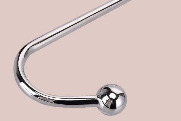 High-quality BDSM anal hook designed for adventurous pleasure. Features a sleek chrome finish, a curved design, and a rounded end for comfortable use. Perfect for enhancing exploration in BDSM play.