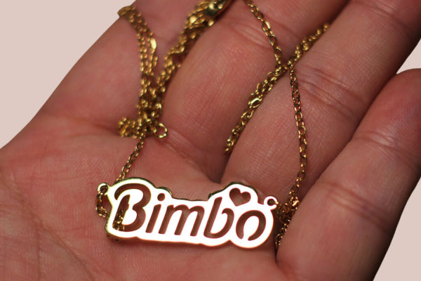 Close-up of the Bimbo Necklace showing its luxurious gold finish.