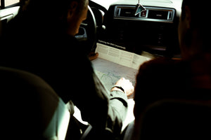 Logan checking the map in his car