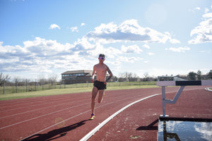 Aric Van Halen running on track