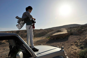 Jungjin Lee on a car hood