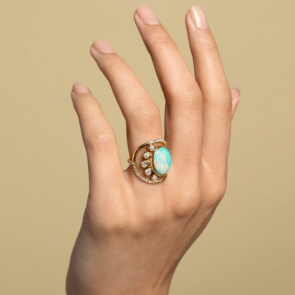 product_details::Australian Opal, Diamond & Sapphire Ring on model.