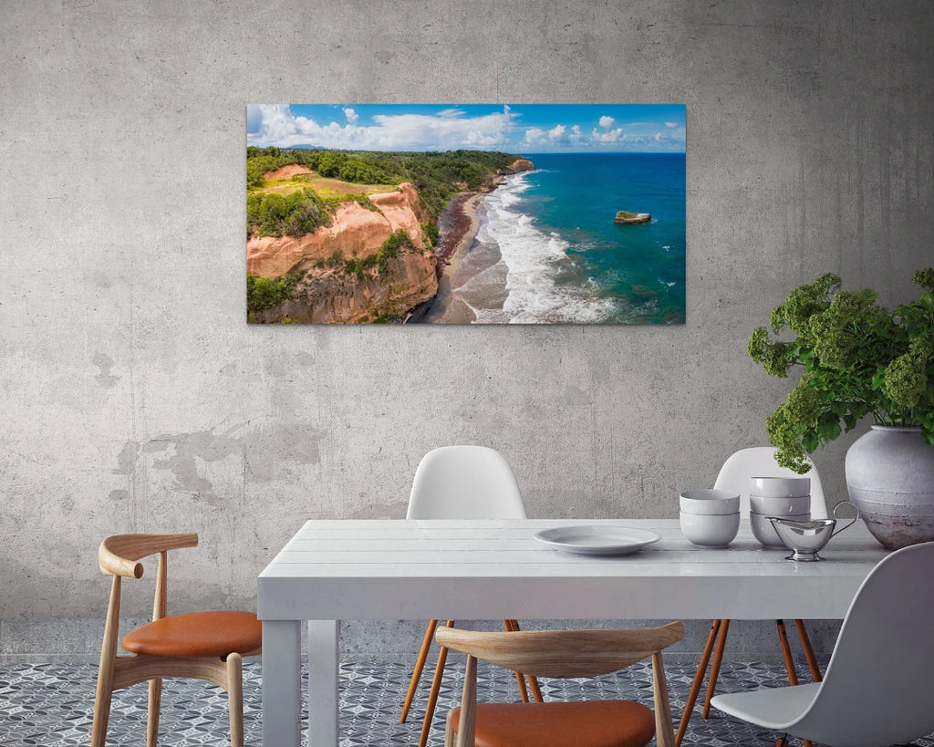 A large canvas print of "Cabana Red Rocks" hung in a dining room above a white table with wooden chairs.
