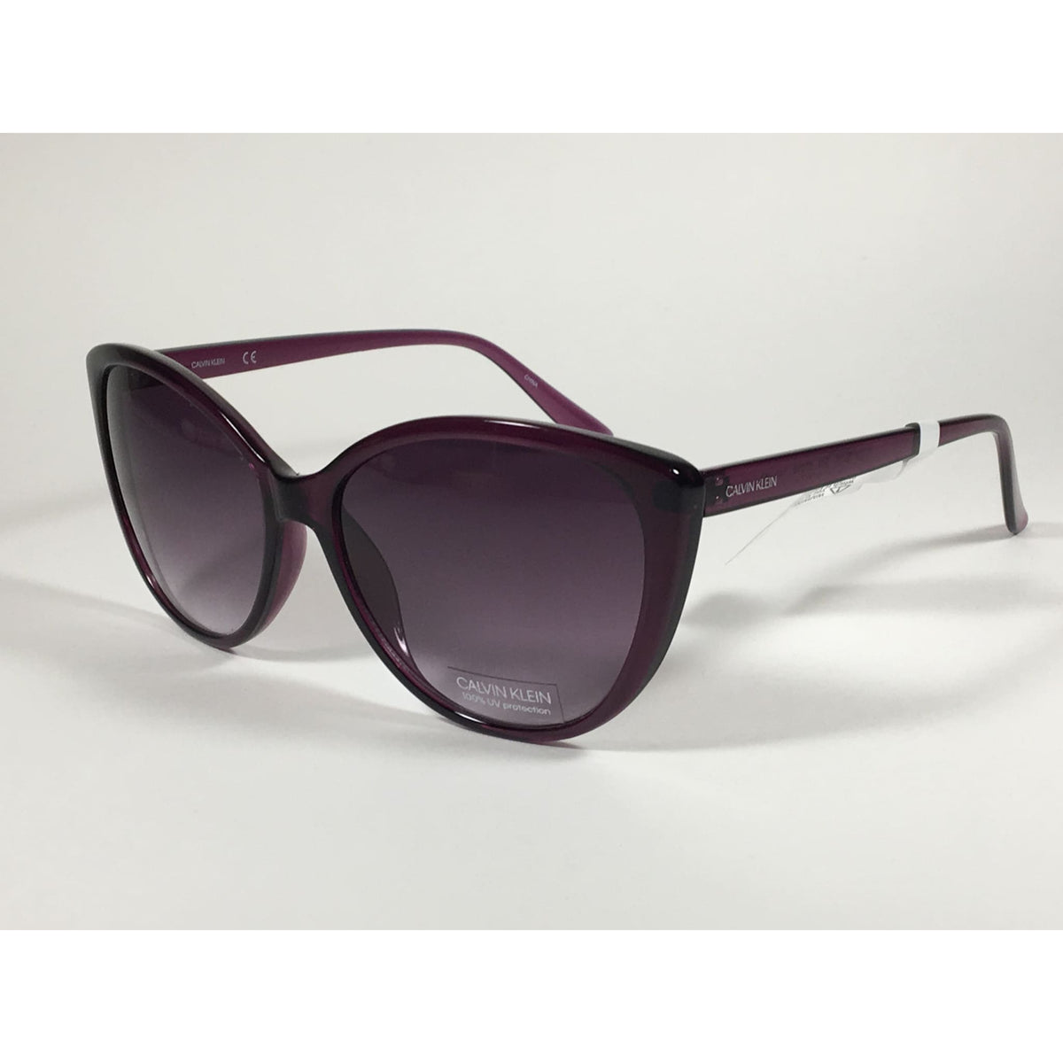 Calvin Klein CK19543S Cat Eye Sunglasses Purple Frame Smoke Gradient Lens