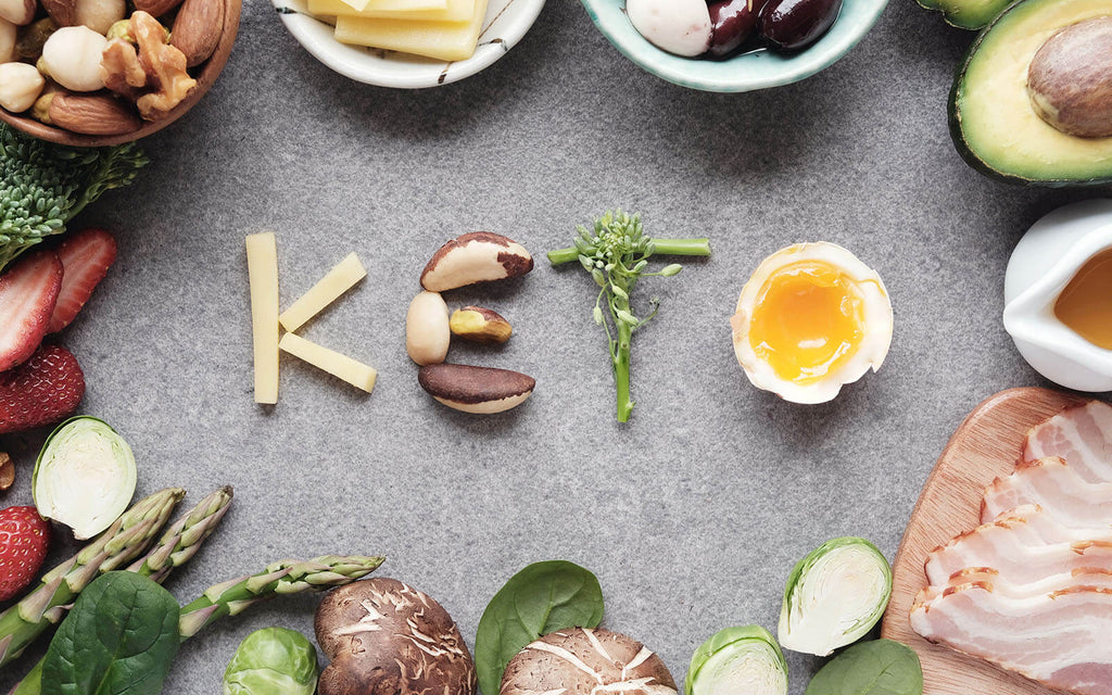 Keto spelled out using food surrounded by various healthy ingredients