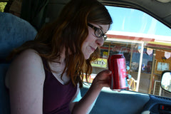 Addicted to sugar - girl drinking soda from can