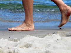 barefoot walking on the beach 