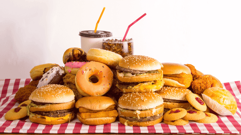 junk food and fried food on picnic table