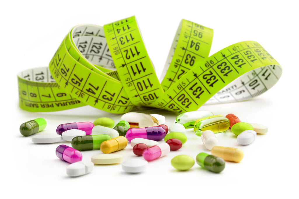 Keto diet pills UK: measuring tape and various pills