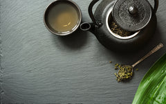 Green tea on black background