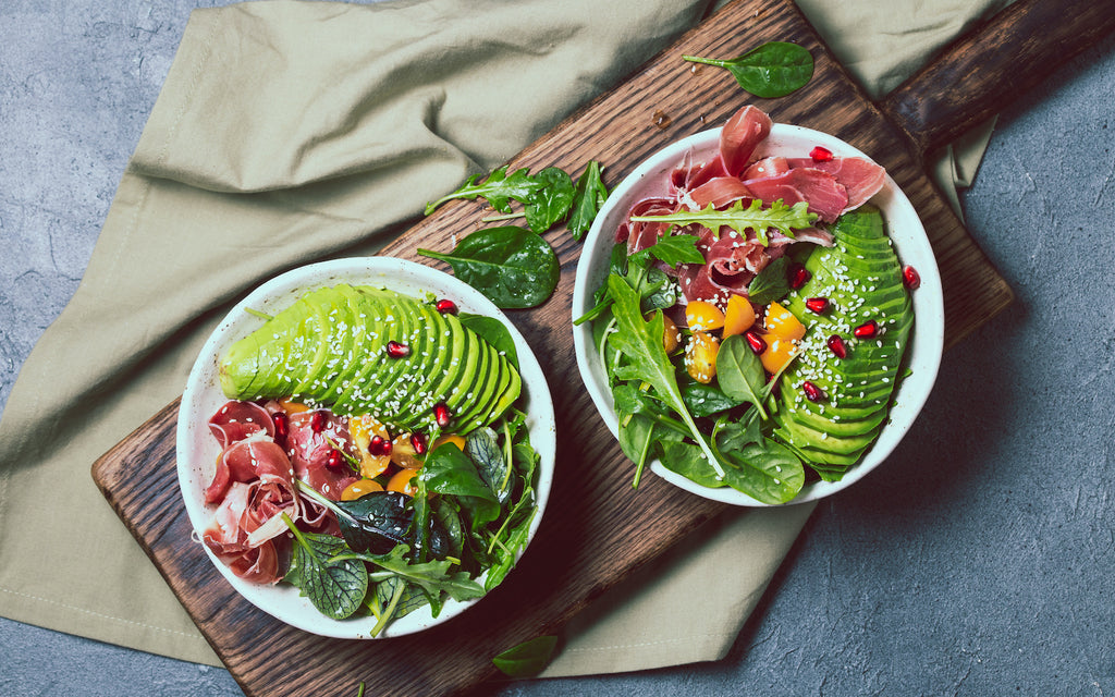 two bowls of salad