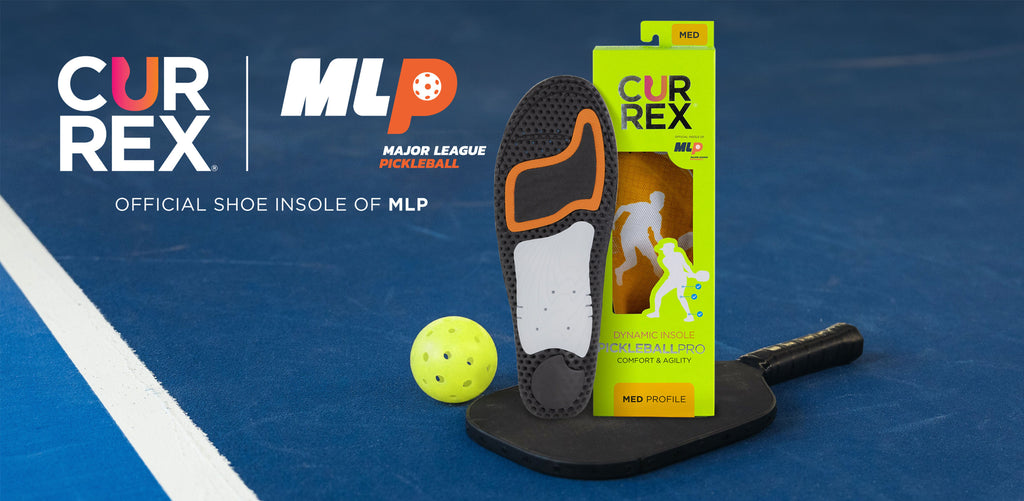 Pickleball shoe insole on a pickleball paddle on a pickleball court