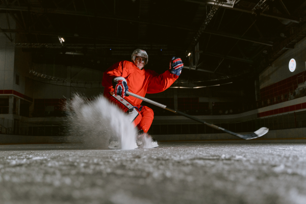 Hockey player skating in an ice rink