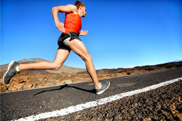 Man heel strike running outside in desert