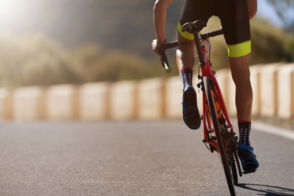 Cyclist riding down a road