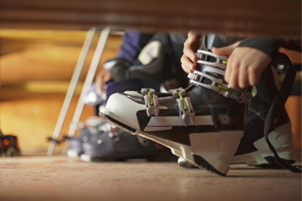 Person putting on and adjusting ski boots