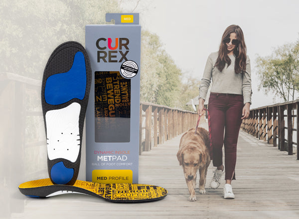 woman walking dog on bridge beside an image of a yellow metatarsal support insole