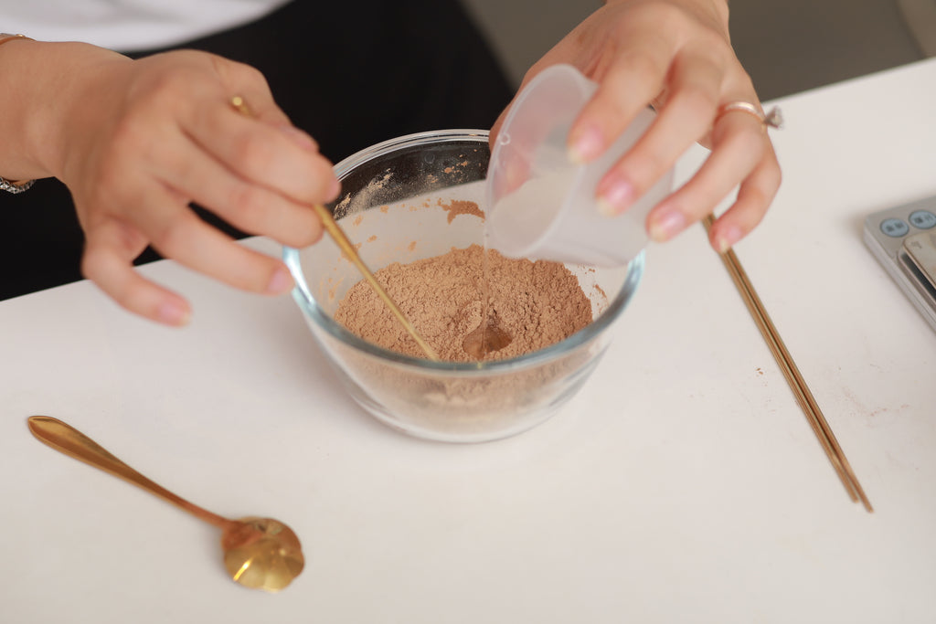 Making natural incense - adding water to incense powder