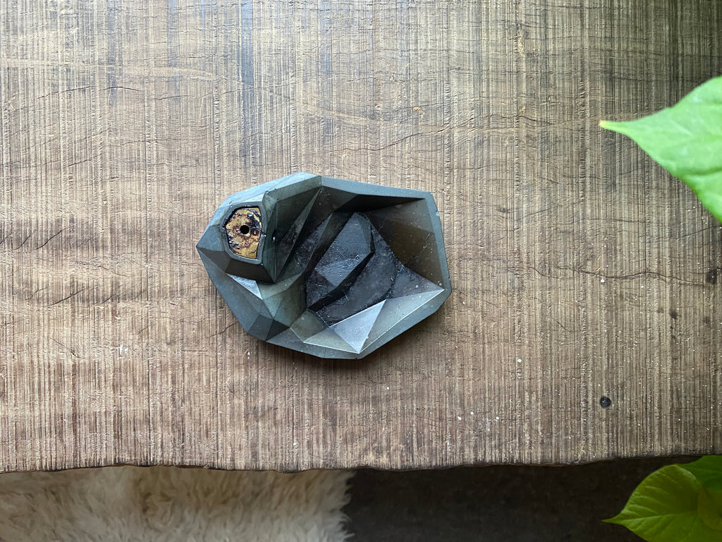 Backflow incense burner with oily residue to be cleaned