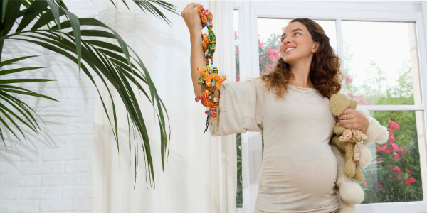 pregnant woman decorating the room