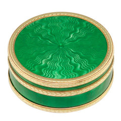 A Fabergé circular green enamel silver-gilt and gold pill box by workmaster Henrik Wigstrom, St Petersburg