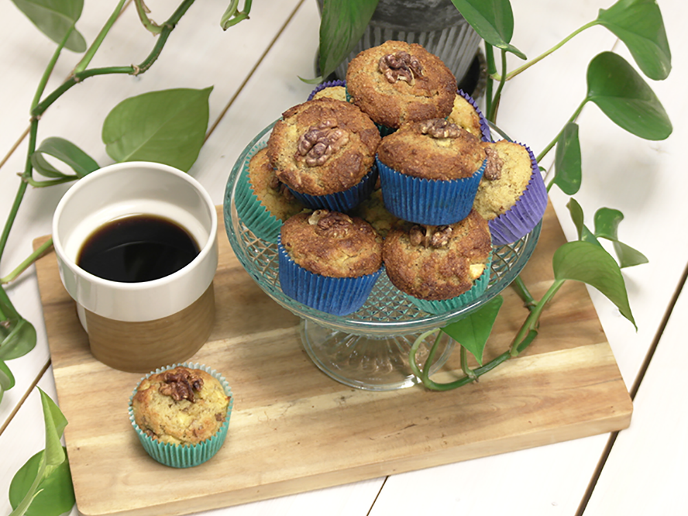 A pile of ketogenic apple-walnut muffins served with black coffee