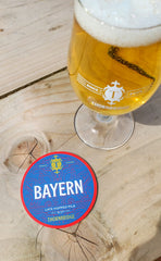 Bayern Lager and keg clip on an outside table at the Taproom