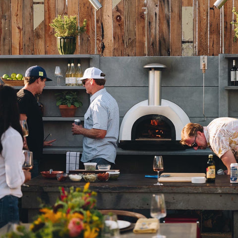 Forno Piombo Pizza Oven Backyard with people