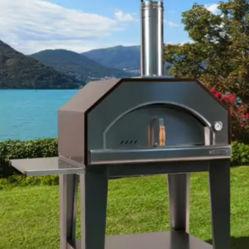 Rossofuoco pizza oven with grass and lake in back