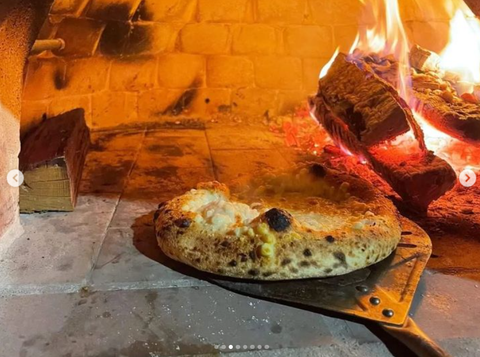 White pizza in Pro Forno Pizza Oven with flames