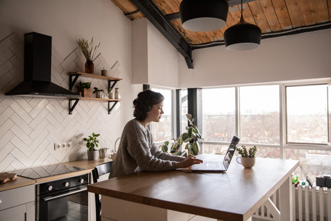 Woman working on the kitchen table