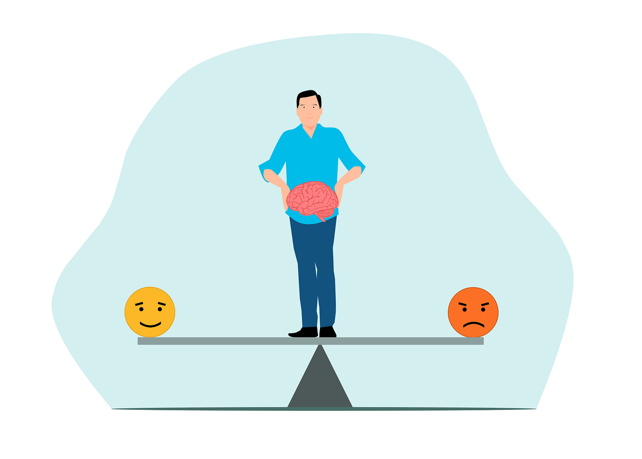 Person holding a brain and standing on a seesaw with happy and sad faces on either side