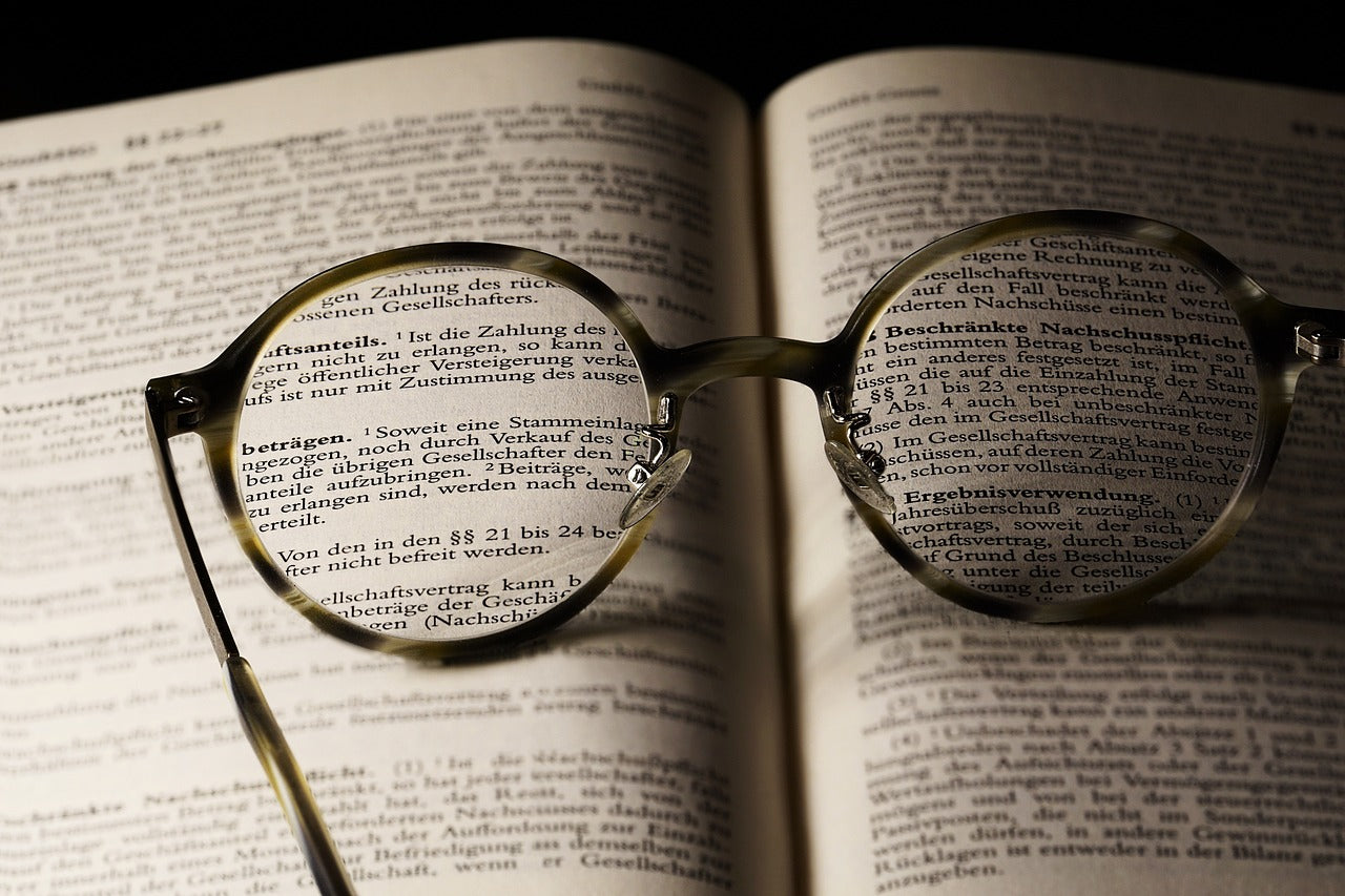 Glasses sitting on open book