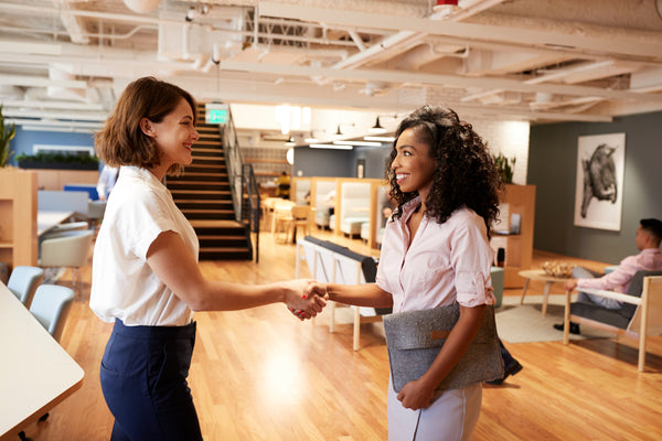 Two people shaking hands.