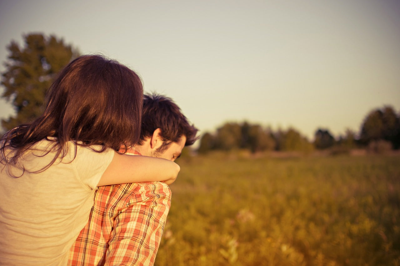 Person giving partner a piggyback ride