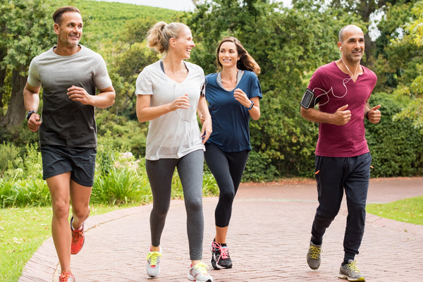 Friends jogging at a park.