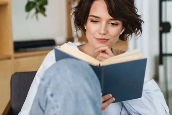 A woman reading a book.