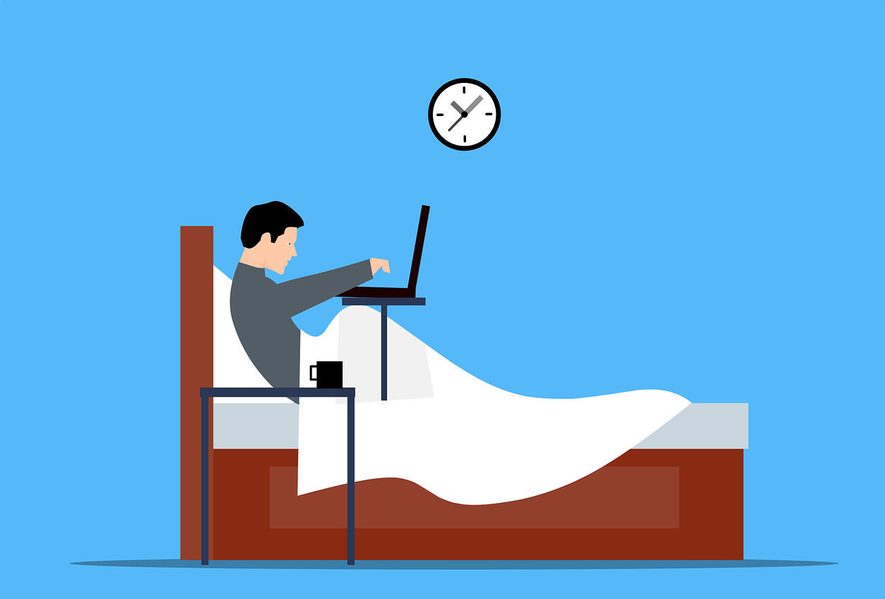 Vector graphic of person in bed with laptop