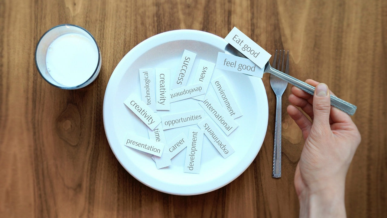 Bowl full of tiles with wellness words written on them